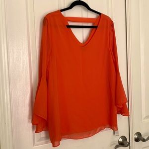 New!! Flowing orange top with bell sleeves. Lined